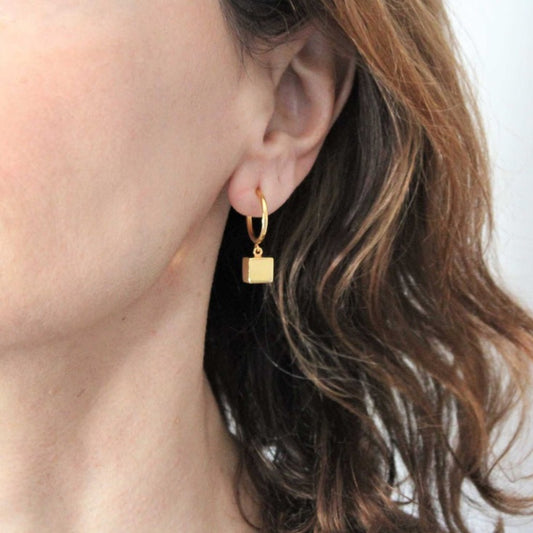 Asymmetrical hoops Kubik 18 carat gold plated silver.