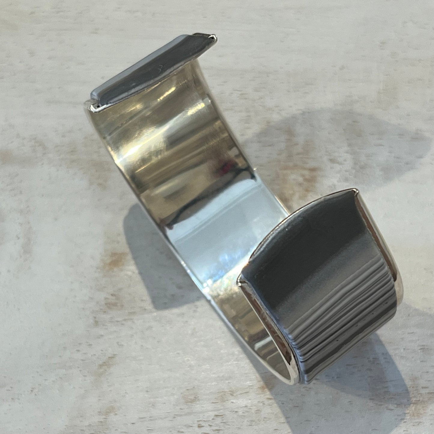 Twilight Shadow sculptural silver cuff bracelet by artisan Stephanie Fraselle with moonlight-inspired contours