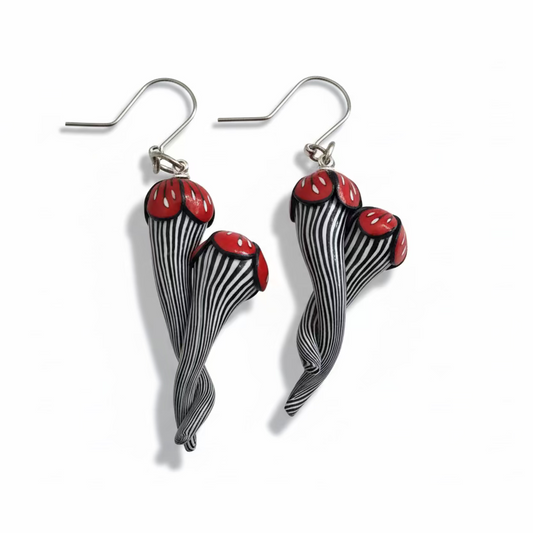 Handmade black and white pinstripe Soul Mates earrings by Lanzarote artisan Stephanie Fraselle with polymer clay flowers and sterling silver accents