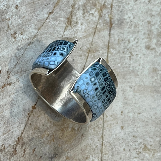 Handcrafted petrol blue and grey shimmer polymer clay mosaic ring from the Sea Foam Series, inspired by ocean waves and organic cellular patterns; adjustable sterling silver–plated brass band fits sizes 54mm–62mm; artisan jewelry with marine and geological textures for a unique, ocean-inspired statement piece.