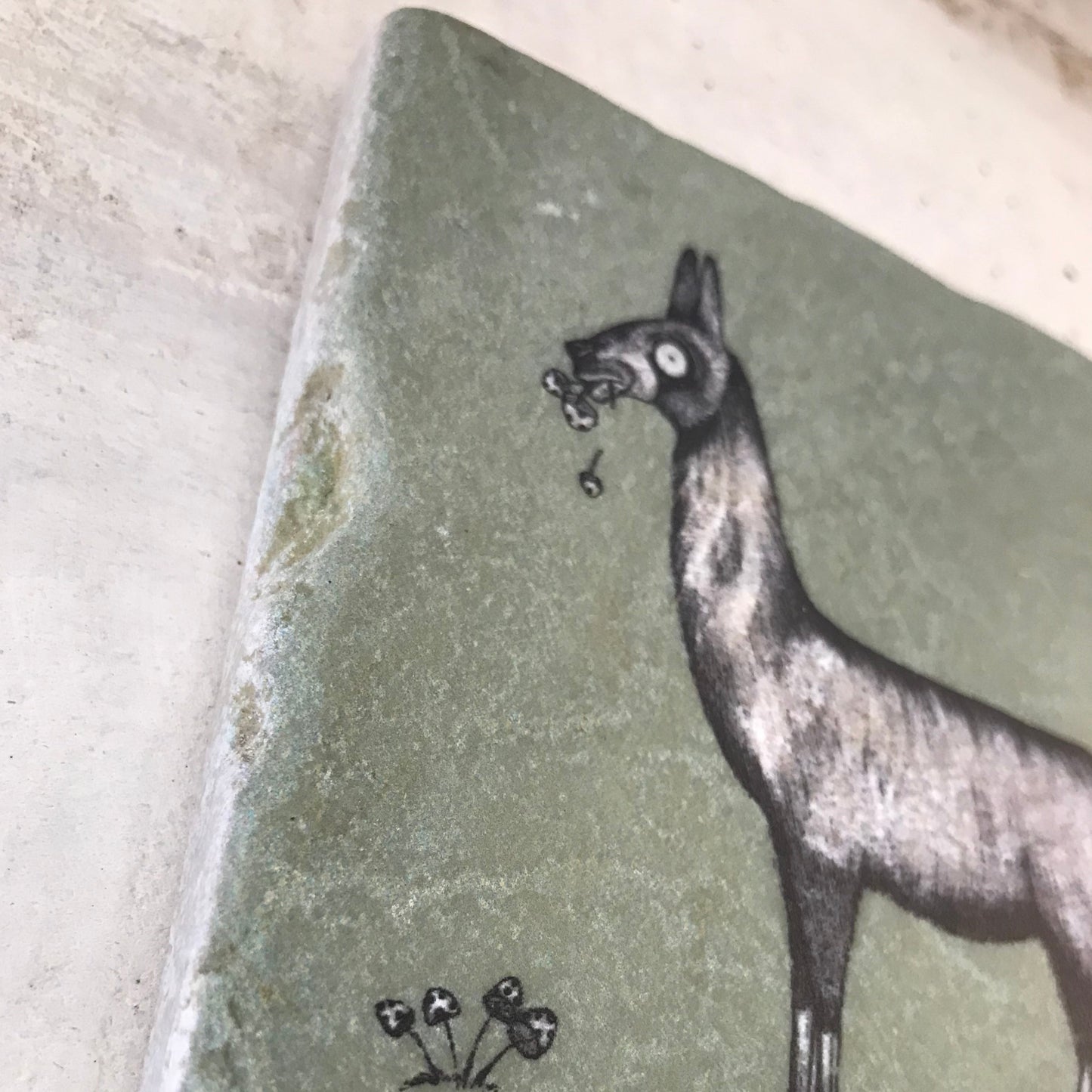 Natural stone art tile “Llama chewing flowers”