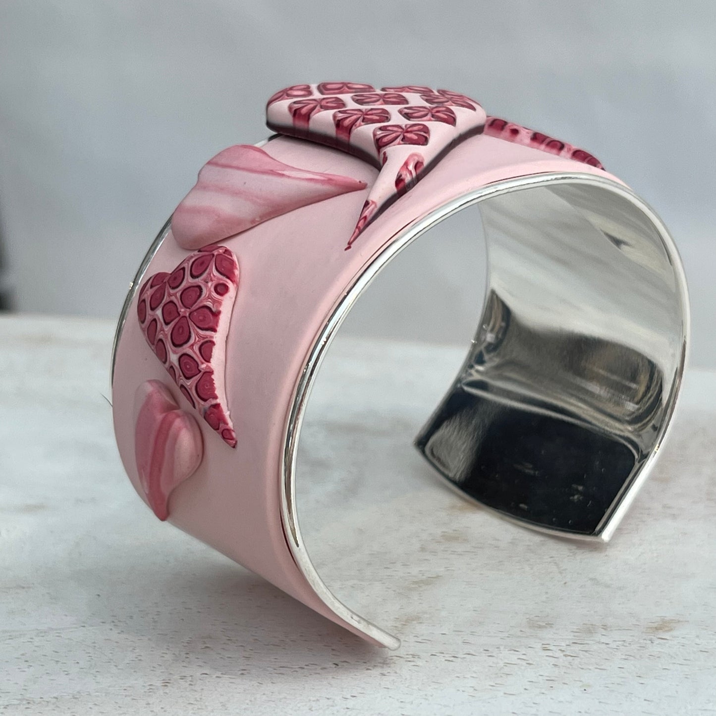 Stephanie Fraselle handcrafted polymer clay love heart bracelet cuff in crimson pink tones