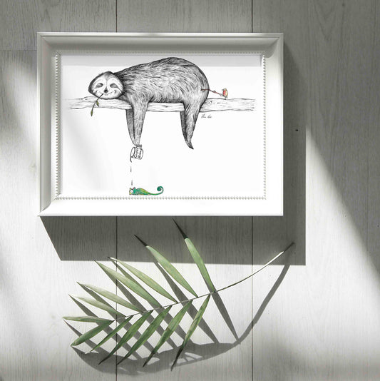 Unframed art print of a relaxed sloth hanging on a log, holding a ‘Carpe Diem’ cup dripping onto a chameleon, while a small bird pokes the sloth’s bottom.”