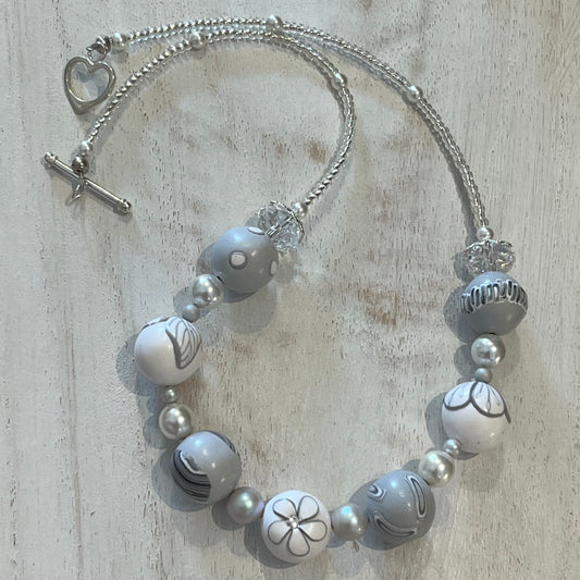White Blossom Collection Necklace by Stephanie Fraselle, featuring handcrafted polymer clay floral beads, Swarovski crystals, sterling silver clasp, and delicate leaf motifs