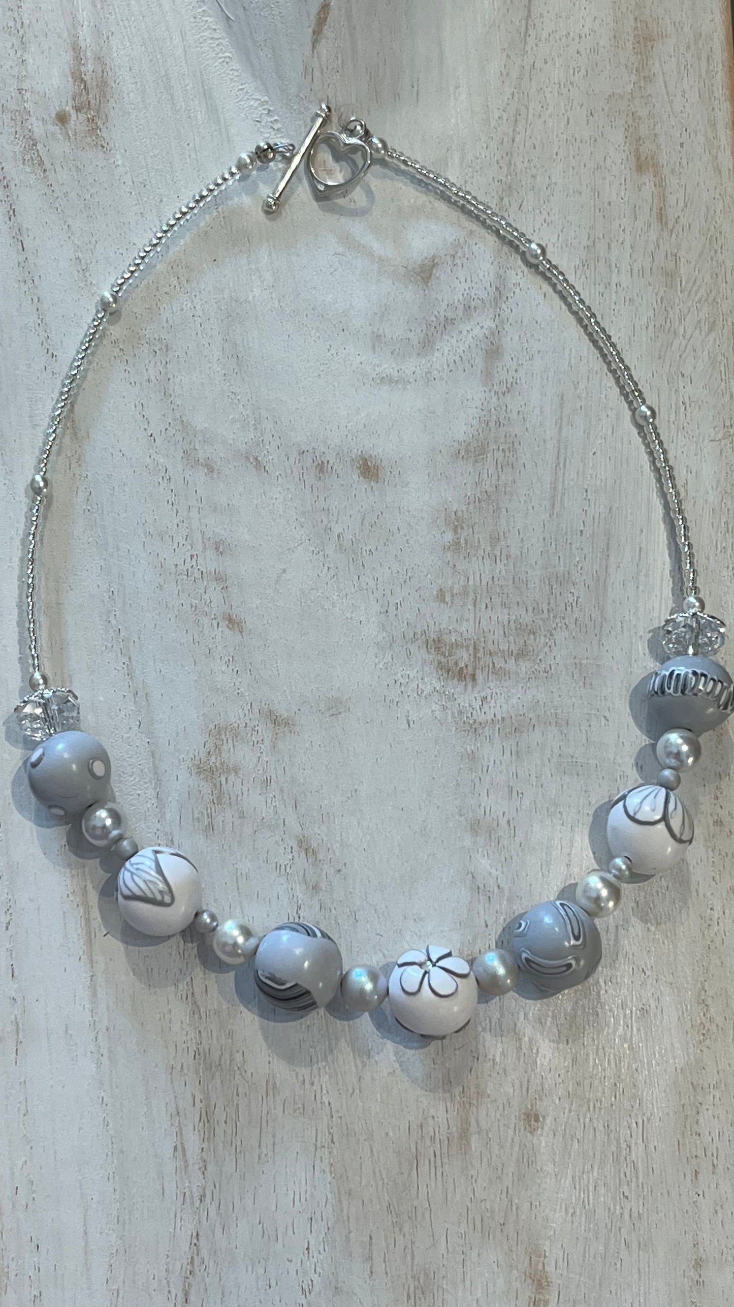 White Blossom Collection Necklace by Stephanie Fraselle, featuring handcrafted polymer clay floral beads, Swarovski crystals, sterling silver clasp, and delicate leaf motifs