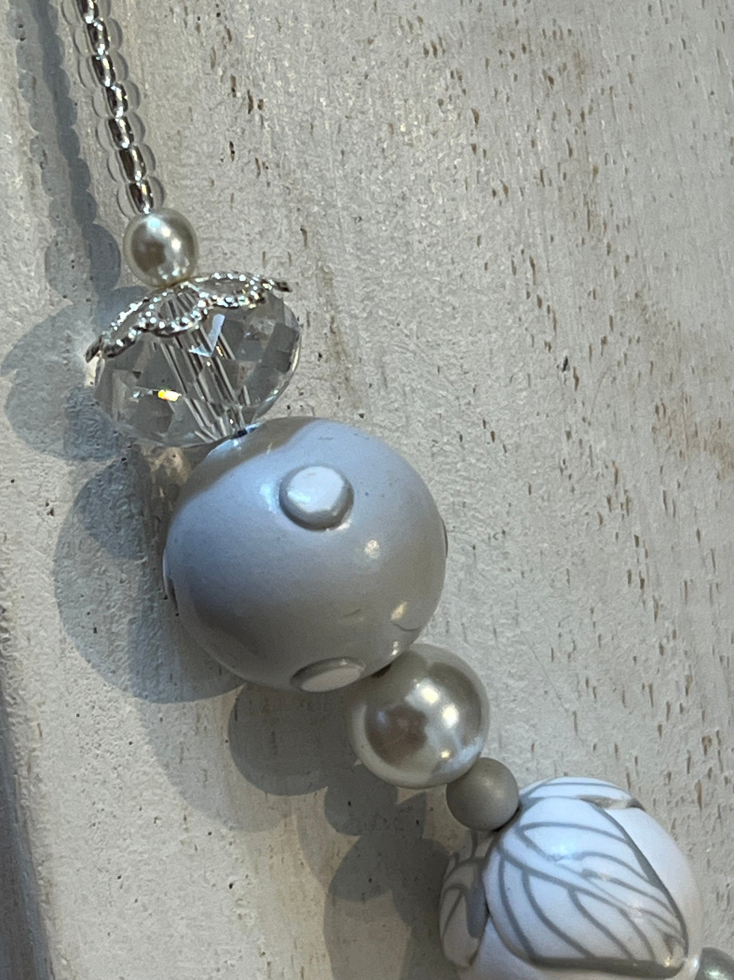 White Blossom Collection Necklace by Stephanie Fraselle, featuring handcrafted polymer clay floral beads, Swarovski crystals, sterling silver clasp, and delicate leaf motifs