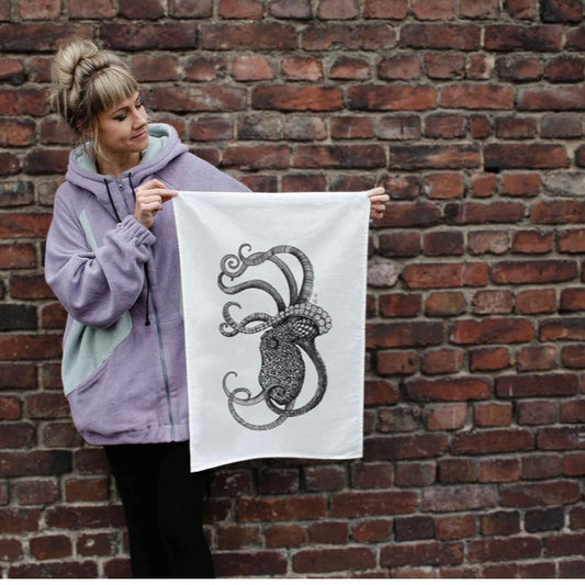 Detailed illustration of an octopus printed on a half linen tea towel