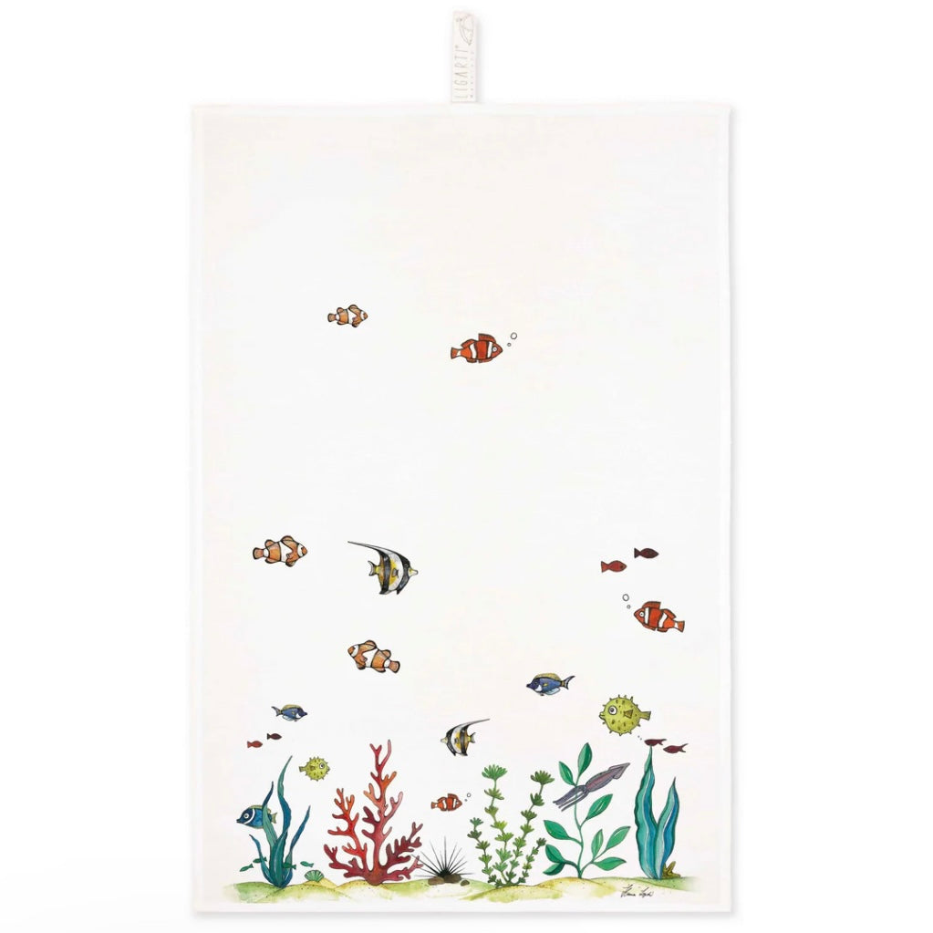 Colourful illustration of a coral reef with fishes swimming happily on a linen tea towel