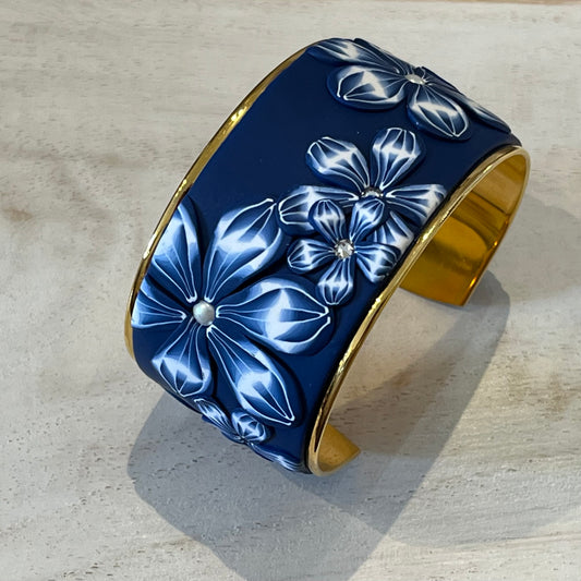 Midnight Navy Bloom Cuff by Stephanie Fraselle, featuring hand-sculpted polymer clay florals, Swarovski pearls, and 24k gold-plated brass