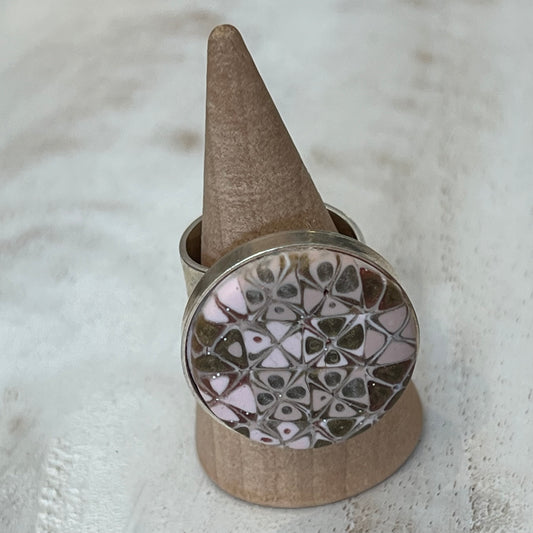 the Rose Gold Mosaic Ring by Stephanie Fraselle features hand-sculpted polymer clay stripes on a sterling silver plated brass base. Adjustable fit. Elegant, nickel-free, and handmade in Lanzarote.