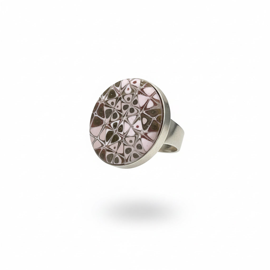 the Rose Gold Mosaic Ring by Stephanie Fraselle features hand-sculpted polymer clay stripes on a sterling silver plated brass base. Adjustable fit. Elegant, nickel-free, and handmade in Lanzarote.