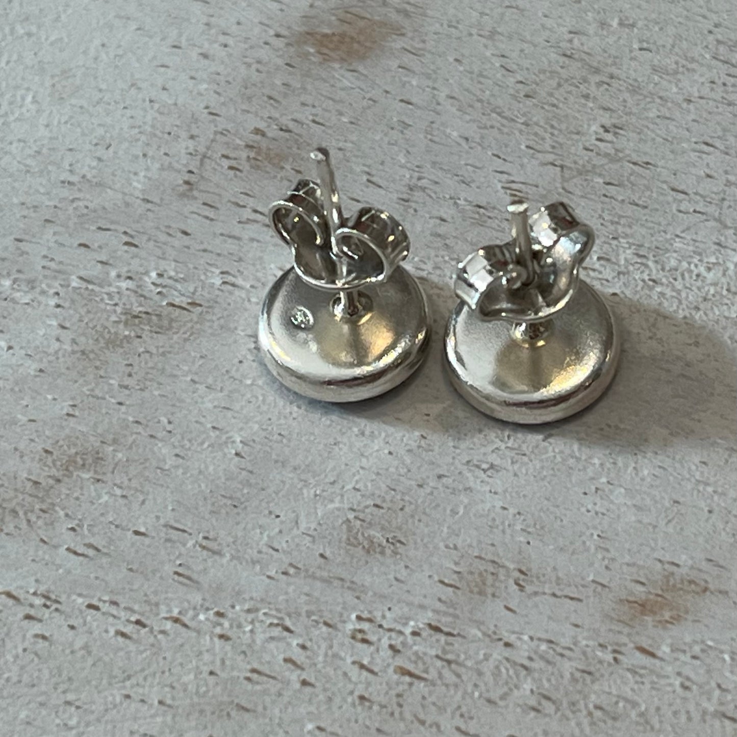 Handcrafted sterling silver stud earrings with sapphire cabochon by Stephanie Fraselle