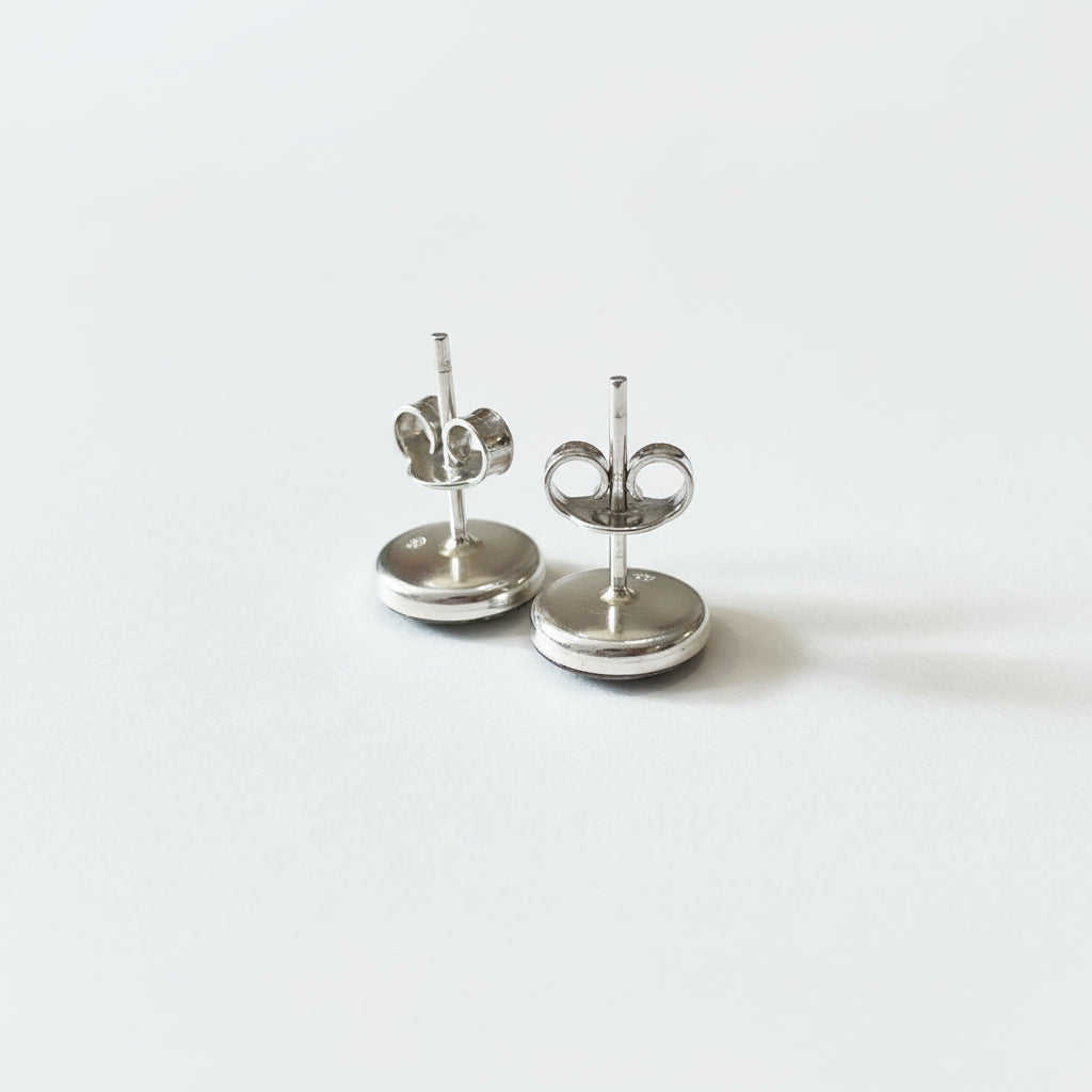 Handcrafted sterling silver stud earrings with sapphire cabochon by Stephanie Fraselle