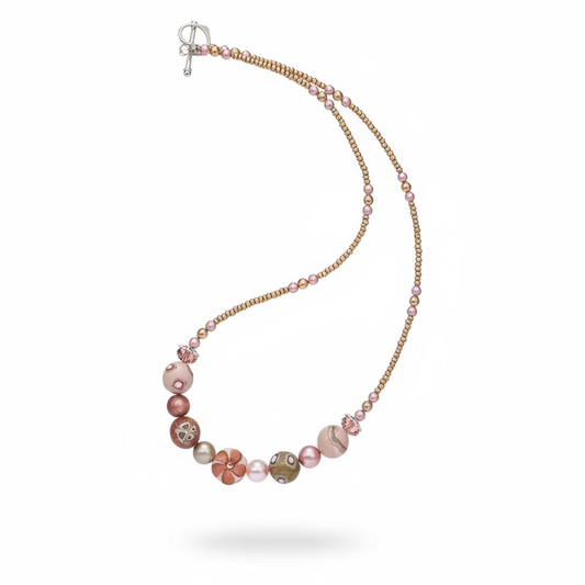 Handmade necklace by Stephanie Fraselle featuring sculpted rose-toned beads, Swarovski pearls, sterling silver, and a heart clasp, inspired by the Queen of Cups archetype.