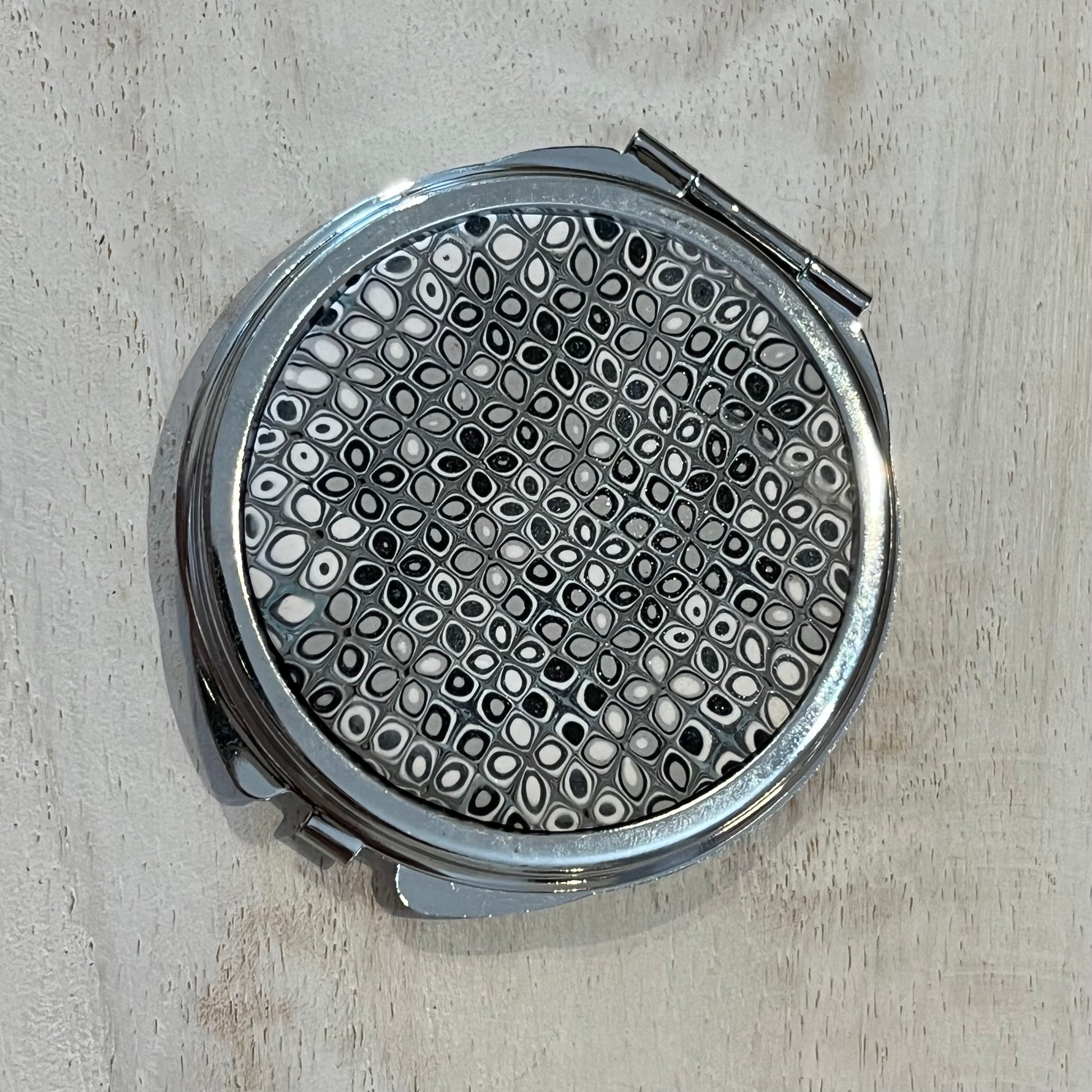 Moonlit Mosaic Shimmer Pocket Mirror by Stephanie Fraselle with hand-laid silver, grey, and pearl clay tiles on rhodium finish