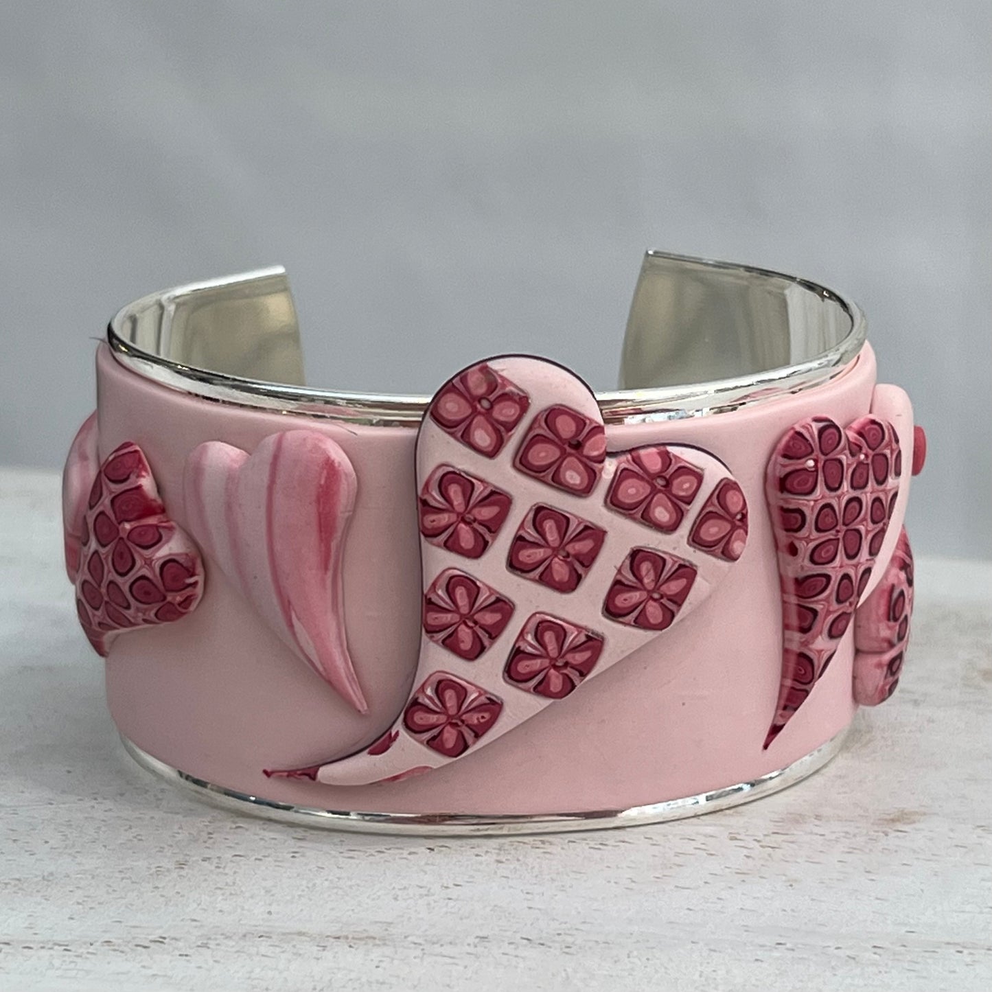 Stephanie Fraselle handcrafted polymer clay love heart bracelet cuff in crimson pink tones