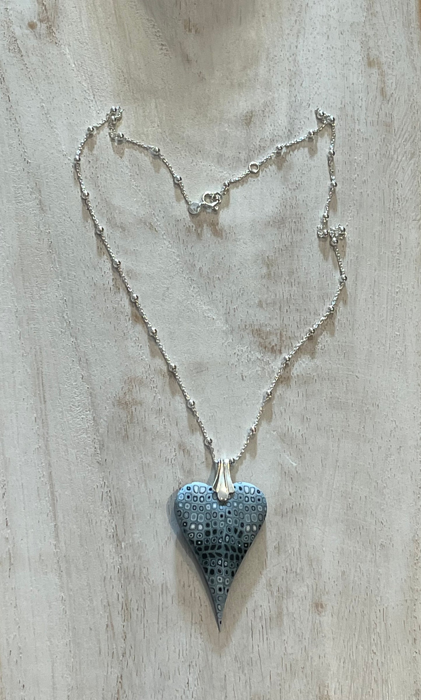 Curved Sculpted Heart pendant by Stephanie Fraselle, handmade in layered polymer clay on a sterling silver chain