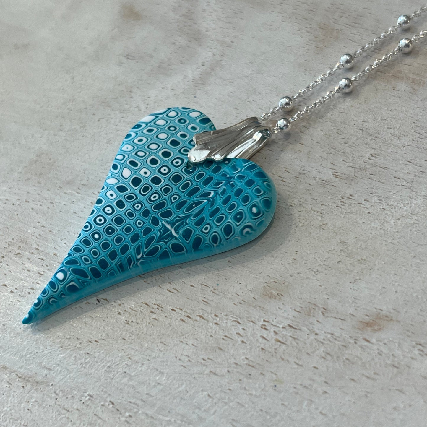 Curved Sculpted Heart Pendant – Tranquil Waters Collection by Stephanie Fraselle
