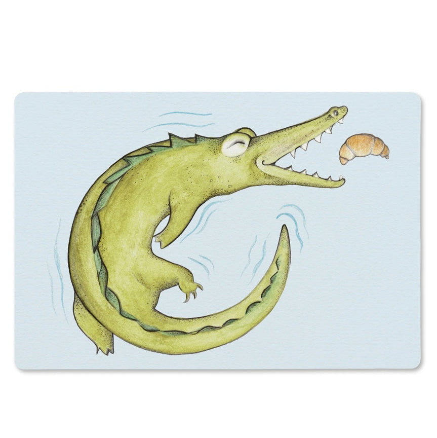 Wooden breakfast board with Hanna’s crocodile and croissant illustration, handcrafted in Sweden from sustainable forestry