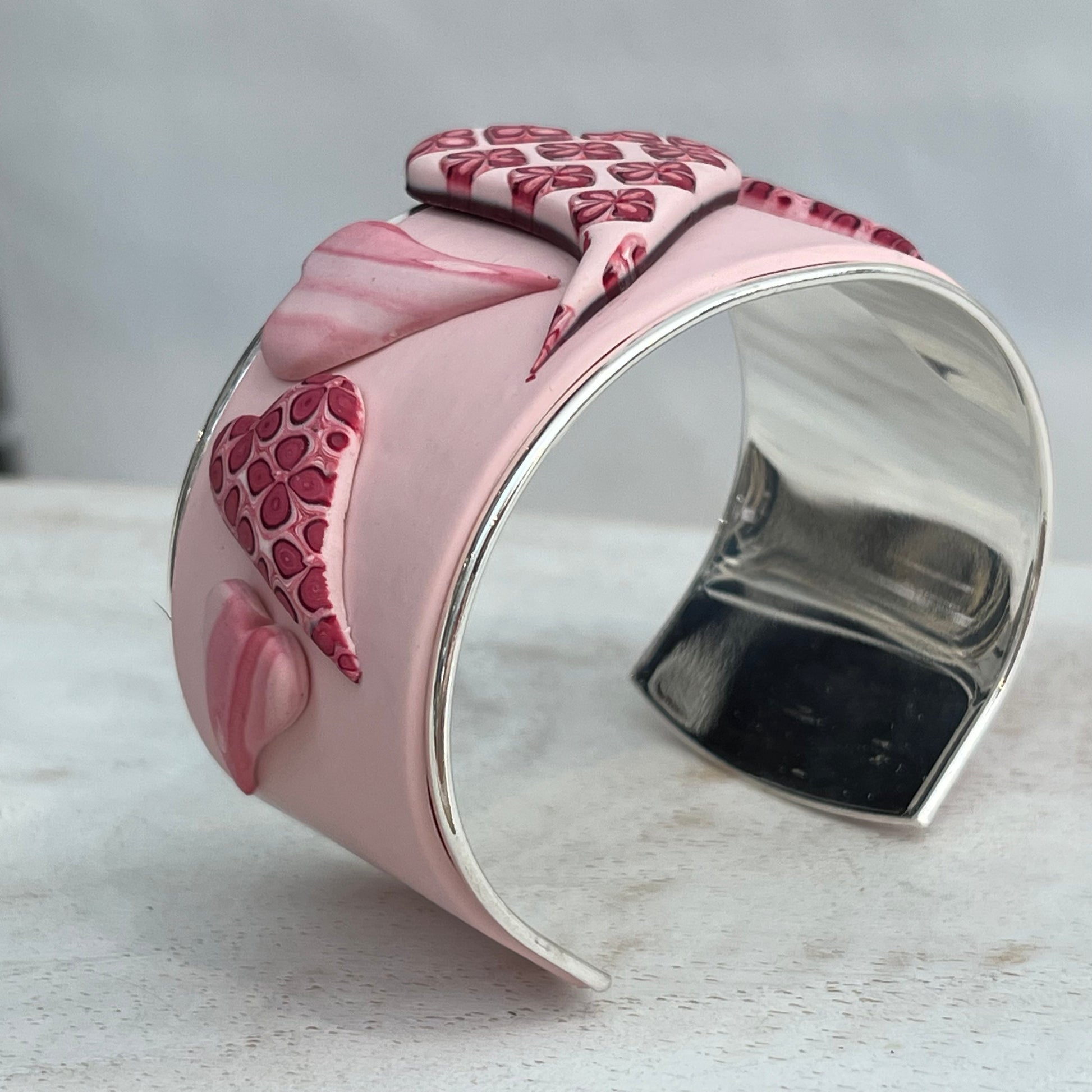 Stephanie Fraselle handcrafted polymer clay love heart bracelet cuff in crimson pink tones