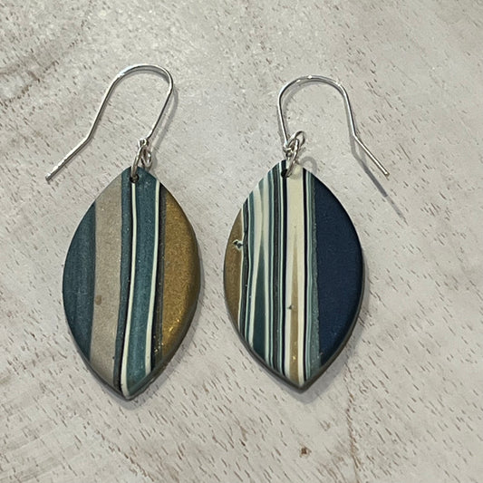Asymmetric Nocturne earring drops by Stephanie Fraselle with gold, pearl, and petrol blue accents handmade in Lanzarote