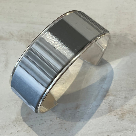 Twilight Shadow sculptural silver cuff bracelet by artisan Stephanie Fraselle with moonlight-inspired contours