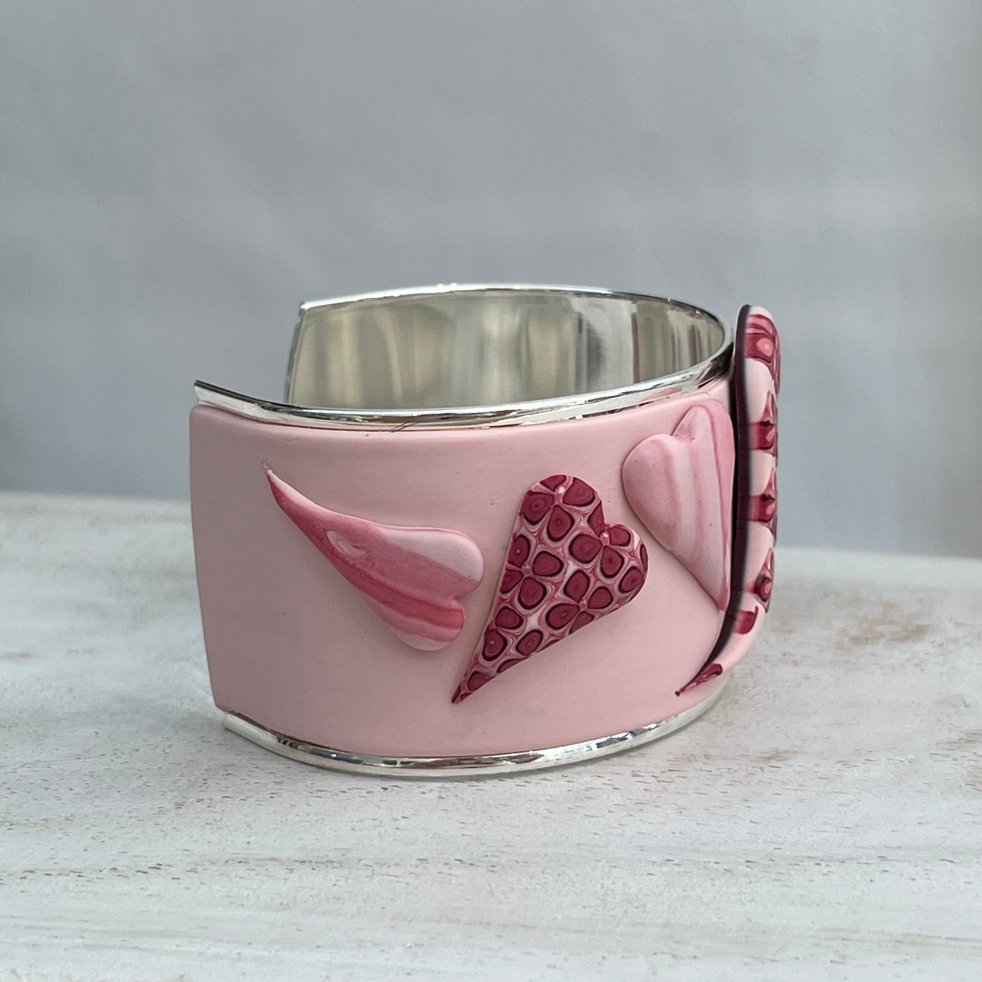 Stephanie Fraselle handcrafted polymer clay love heart bracelet cuff in crimson pink tones