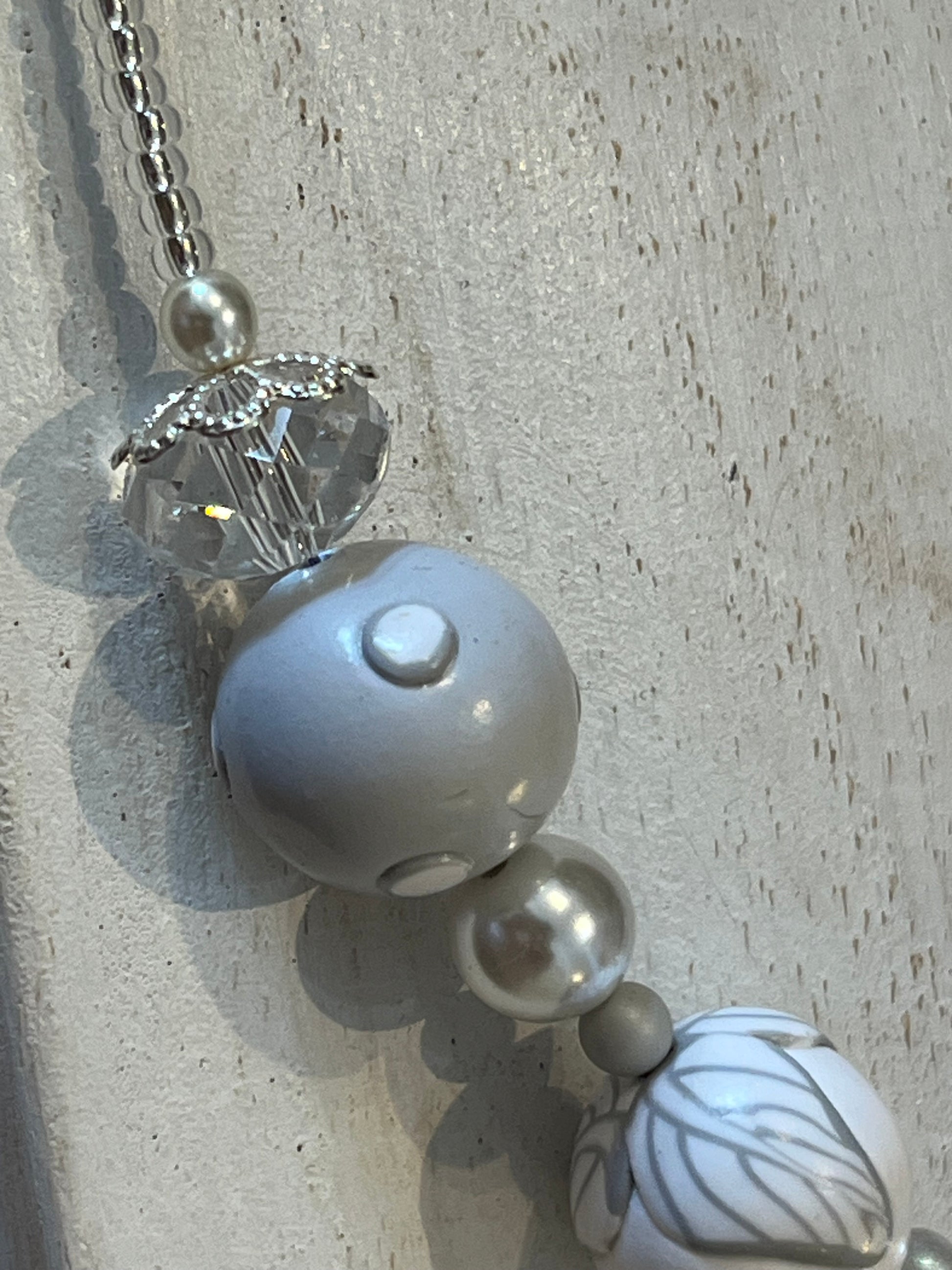 White Blossom Collection Necklace by Stephanie Fraselle, featuring handcrafted polymer clay floral beads, Swarovski crystals, sterling silver clasp, and delicate leaf motifs