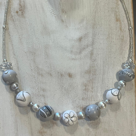 White Blossom Collection Necklace by Stephanie Fraselle, featuring handcrafted polymer clay floral beads, Swarovski crystals, sterling silver clasp, and delicate leaf motifs