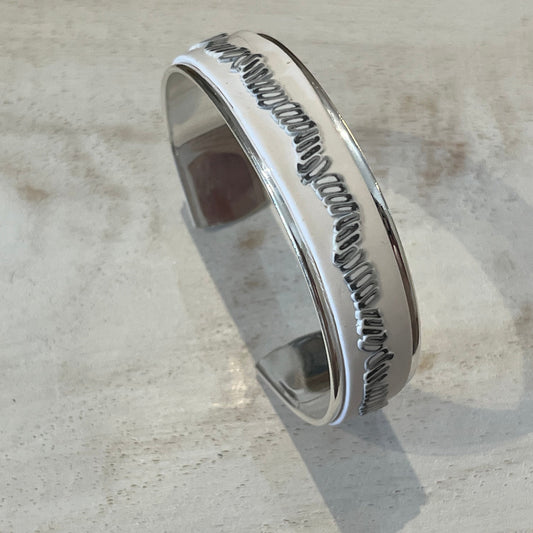 White Blossom Mosaic Cuff by Stephanie Fraselle featuring a matte white band and a linear mosaic of grey and white tiles, handcrafted from polymer clay with slight adjustability and a sterling silver-plated finish.