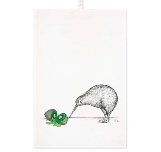 Black and white kiwi bird illustration looking at a colourful watercolour of a sliced green kiwi fruit on a linen tea towel
