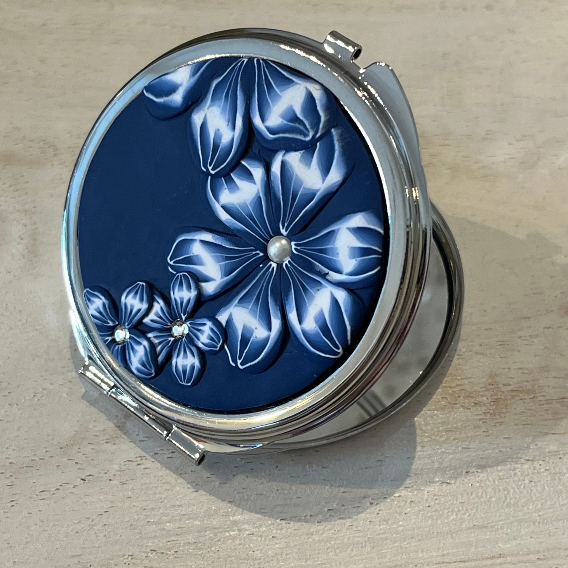 Navy Blue Floral Bloom Pocket Mirror by Stephanie Fraselle, handcrafted in polymer clay with Swarovski crystal accents