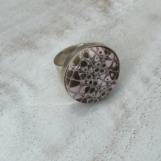 the Rose Gold Mosaic Ring by Stephanie Fraselle features hand-sculpted polymer clay stripes on a sterling silver plated brass base. Adjustable fit. Elegant, nickel-free, and handmade in Lanzarote.