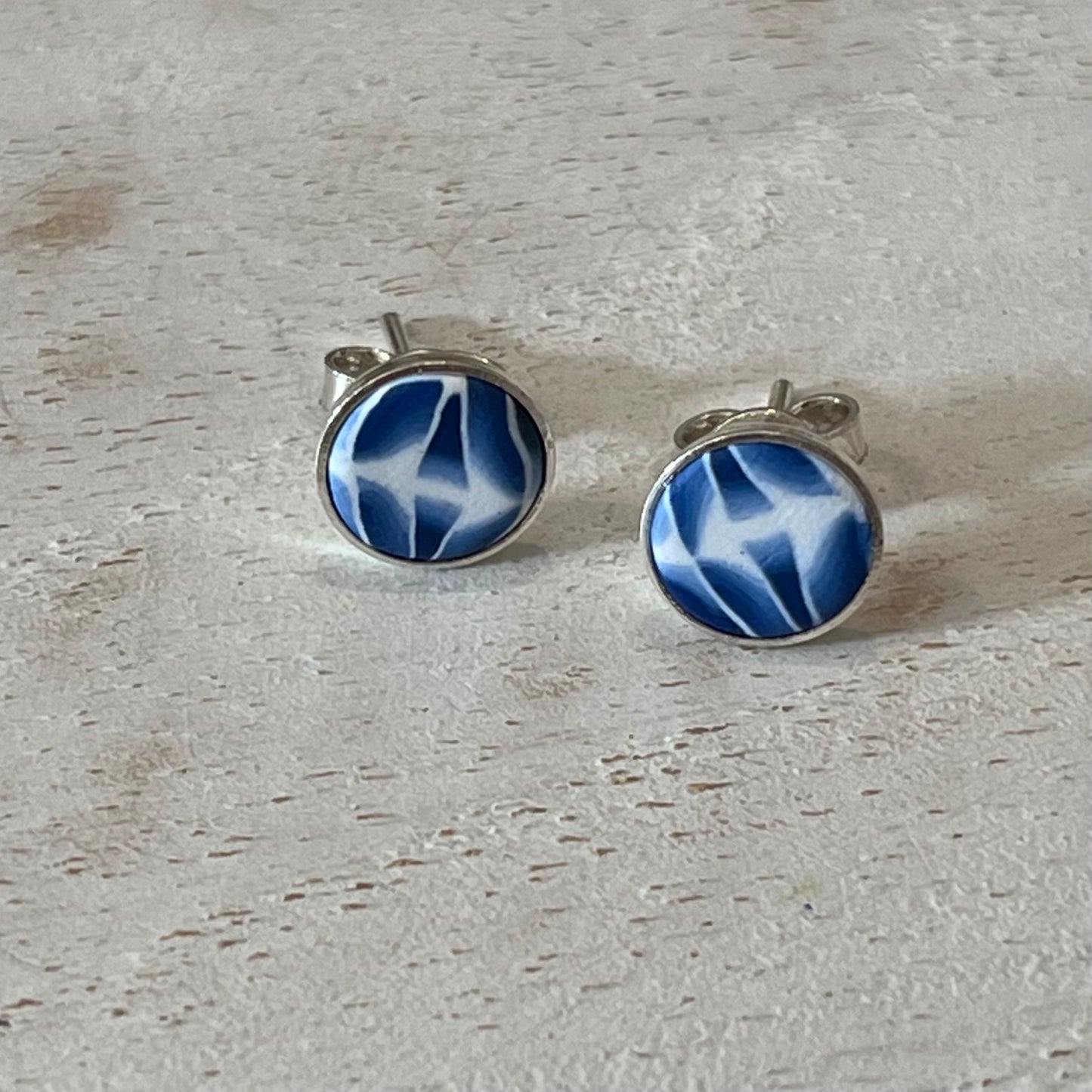 Handcrafted sterling silver stud earrings with sapphire cabochon by Stephanie Fraselle