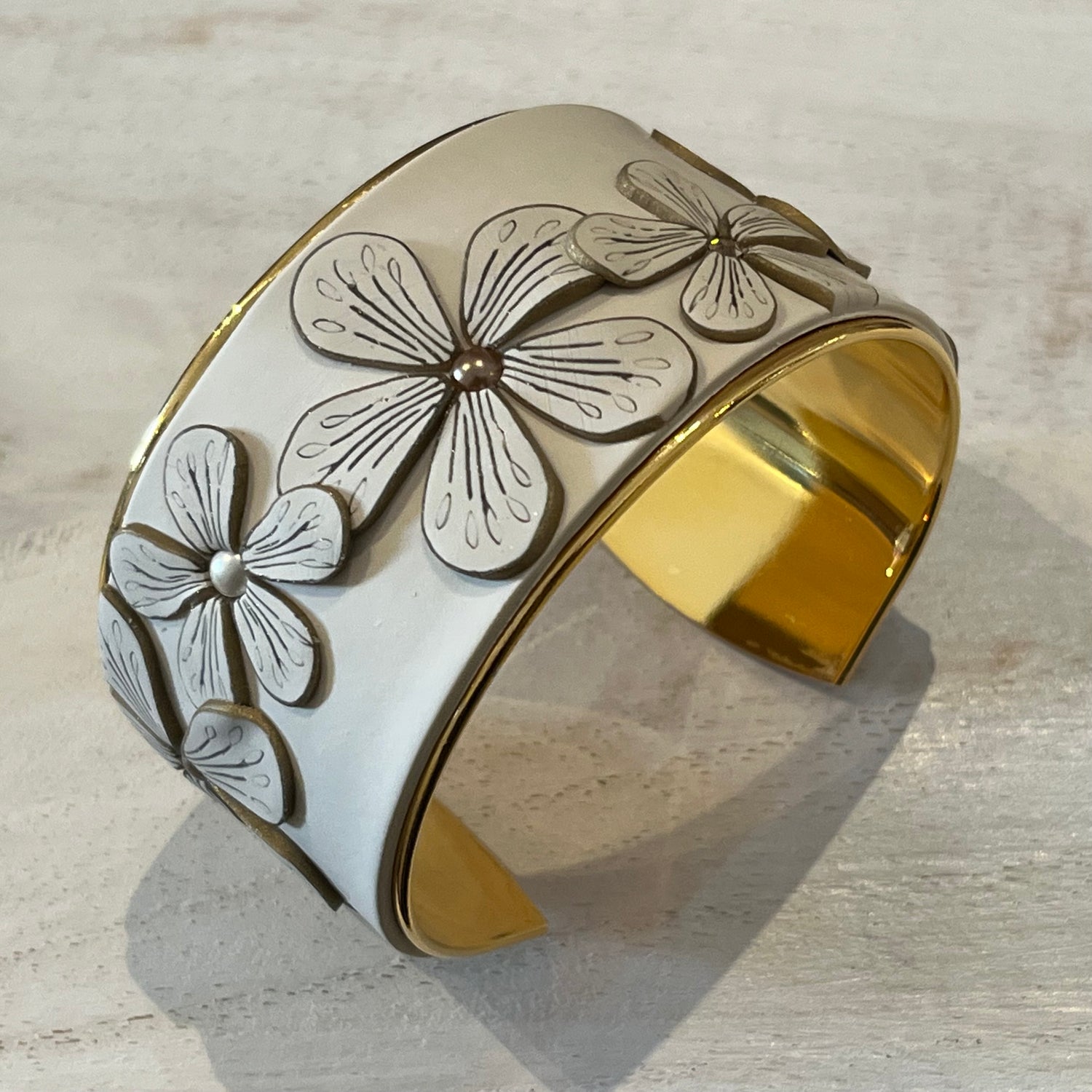 Cappuccino sculptural cuff in cappuccino cream with chocolate brown definition, Swarovski golden topaz crystals, bronze pearls, and a flexible 24k gold-plated brass interior