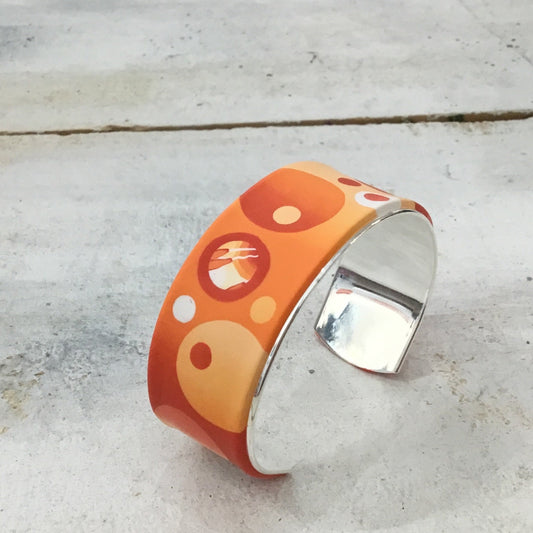 Brazalete brazalete naranja “Universo” de Stephanie Fraselle - Diseño de joyería artesanal